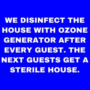 a blue background with the words we distract the house with ozone generator after every guest at Strandfürdő Apartman in Eger