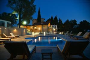 The swimming pool at or close to Sunset & Sunrise Villas in Stanisici-Two Villas With Common Pool