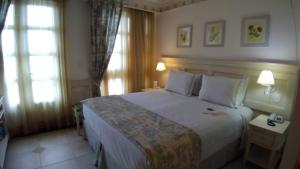 Кровать или кровати в номере Il Campanario