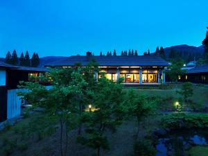 a house at night with the lights on at Hotel Kikori in Hida