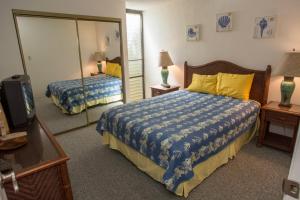 En eller flere senge i et værelse på Kihei Holiday 116