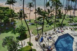 an aerial view of a resort with a pool and a beach at Mana Kai 710A in Wailea