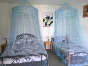 Ένα ή περισσότερα κρεβάτια σε δωμάτιο στο Pintuyan Dive Resort
