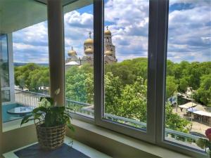 a window with a view of a building at By the CATHEDRAL · TOP center · 2 Bedroom FLAT in Varna City