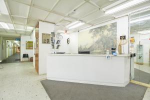 a white counter in a room with a painting on the wall at Bellevue The Penang Hill Hotel in Ayer Itam