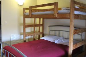 a bedroom with two bunk beds in a room at Moulin2Roues in Artannes-sur-Thouet