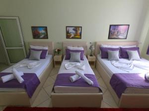 Postel nebo postele na pokoji v ubytování Hotel Bicaj