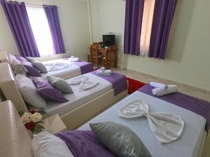 Postel nebo postele na pokoji v ubytování Hotel Bicaj