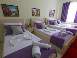 Postel nebo postele na pokoji v ubytování Hotel Bicaj
