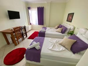 Postel nebo postele na pokoji v ubytování Hotel Bicaj