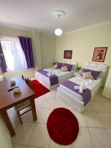 Postel nebo postele na pokoji v ubytování Hotel Bicaj