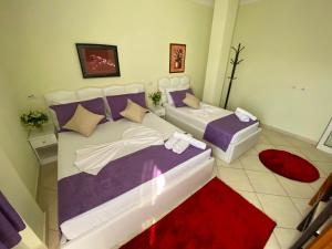 Postel nebo postele na pokoji v ubytování Hotel Bicaj