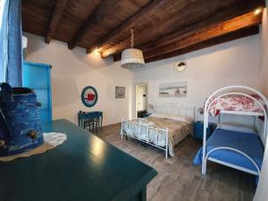 Postel nebo postele na pokoji v ubytování B&B La Terrazza di NonnAnna