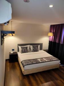 Postel nebo postele na pokoji v ubytování 9 Square Hotel - Subang + 37 fotografií