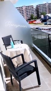 a table and chairs on the balcony of a building at Studio Katerina in Mamaia