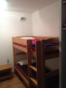 a room with two bunk beds in a room at CHALET DE BOIS MEAN in Les Orres +14 photos