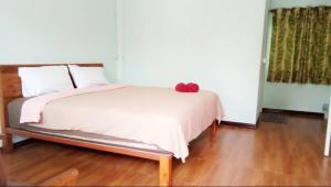 Ένα ή περισσότερα κρεβάτια σε δωμάτιο στο WISET SABAI RESORT