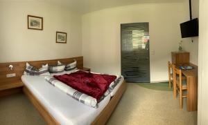 Letto o letti in una camera di Pension Seeheim