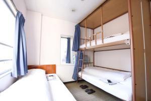 Letto o letti in una camera di Sakura Hotel Jimbocho