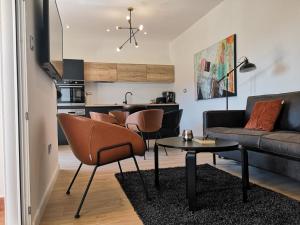 a living room with a couch and a table at Apartments Antoana in Hvar