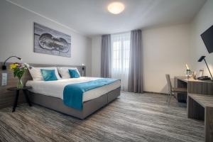 Posteľ alebo postele v izbe v ubytovaní Hotel Páv