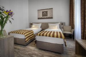Posteľ alebo postele v izbe v ubytovaní Hotel Páv