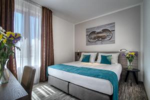 Cama ou camas em um quarto em Hotel Páv