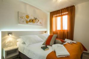 Posteľ alebo postele v izbe v ubytovaní Aparthotel Gimi