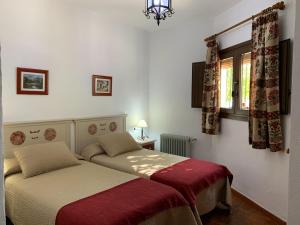 Postel nebo postele na pokoji v ubytování Hostal Atalaya en Capileira CB
