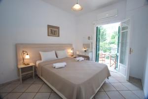 Posteľ alebo postele v izbe v ubytovaní Panorama Apartments Fiscardo