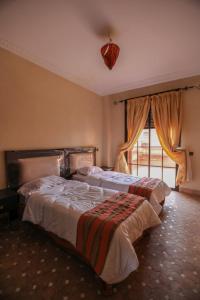 Łóżko lub łóżka w pokoju w obiekcie Top Garden Villa Marrakech