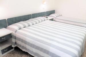 Postel nebo postele na pokoji v ubytování Hotel Aurea