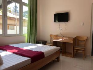 TV a/nebo společenská místnost v ubytování Mango Hotel Dalat
