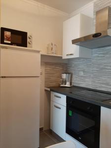 Kuchyň nebo kuchyňský kout v ubytování Rooms Neda