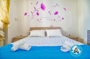 A bed or beds in a room at Appartamenti di Catia a due passi dal mare
