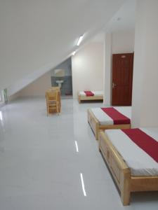 Postel nebo postele na pokoji v ubytování Mango Hotel Dalat