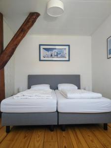 Postel nebo postele na pokoji v ubytování Le-Clochard