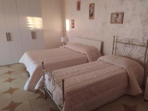 Postel nebo postele na pokoji v ubytování B&B La Felicità