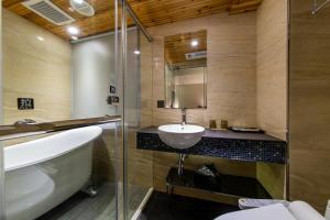 a bathroom with a sink and a shower at Beauty Hotels Taipei - Hotel Bfun in Taipei +53 photos