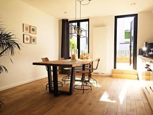 a dining room with a table and some chairs at Kloosterloft in Antwerp