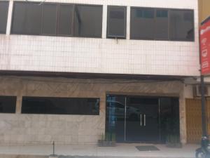 a building with a car parked inside of it at Hotel Mayang Sari 1 in Jambi