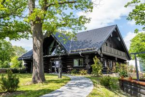 a log cabin with a solar roof at Timberjacks Kassel Motel in Kassel