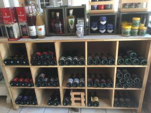 a shelf filled with lots of bottles of wine at B&B Wisteria in Herne