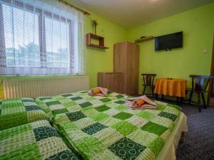 Ένα ή περισσότερα κρεβάτια σε δωμάτιο στο Apartmány Tatry EURO-CRV