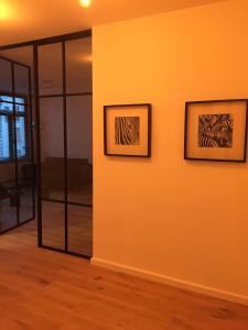 two framed drawings of zebras on a wall at Kloosterloft in Antwerp