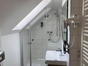 Koupelna v ubytování Hotel B54 Heidelberg City Center + 37 fotografií