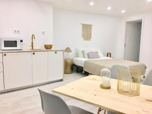 a room with a bed and a table with a kitchen at Sintra Center Guest House Escape to Nature in Sintra