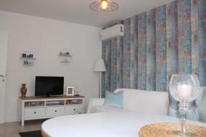 Katil atau katil-katil dalam bilik di Holiday Apartment