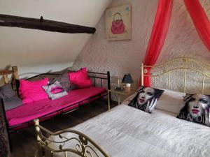Postel nebo postele na pokoji v ubytování La Longère du Parc