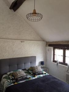 Postel nebo postele na pokoji v ubytování La Longère du Parc